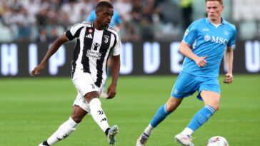 TURIN, ITALY - SEPTEMBER 21: Pierre Kalulu of Juventus passes the ball under pressure from Scott McTominay of Napoli during the Serie A match between Juventus and Napoli at Allianz Stadium on September 21, 2024 in Turin, Italy. (Photo by Marco Luzzani/Getty Images)