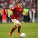 MUNICH, GERMANY - MARCH 08: Aleksandar Pavlovic of FC Bayern München runs with the ball during the Bundesliga match between FC Bayern München and VfL Bochum 1848 at Allianz Arena on March 08, 2025 in Munich, Germany. (Photo by Alexander Hassenstein/Getty Images)